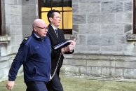 Teacher Enoch Burke is led away from the High Court in Dublin following proceedings related to his ongoing legal dispute over court orders barring him from Wilson’s Hospital School in County Westmeath.