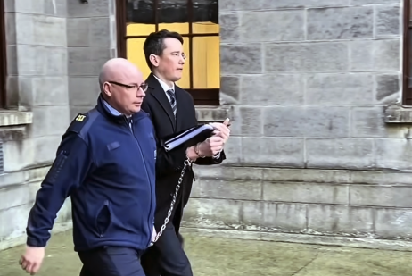 Teacher Enoch Burke is led away from the High Court in Dublin following proceedings related to his ongoing legal dispute over court orders barring him from Wilson’s Hospital School in County Westmeath.