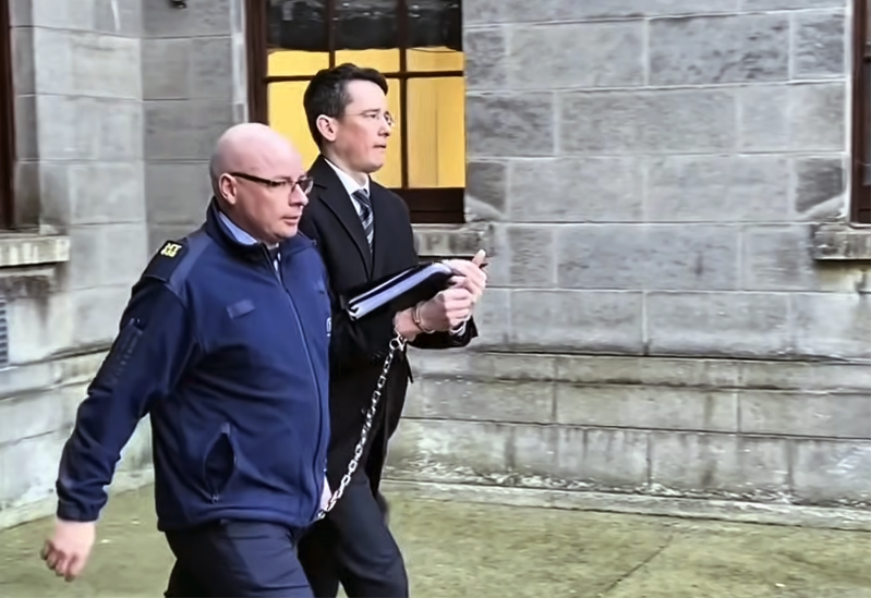Teacher Enoch Burke is led away from the High Court in Dublin following proceedings related to his ongoing legal dispute over court orders barring him from Wilson’s Hospital School in County Westmeath.
