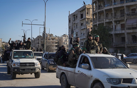 ALEPPO, SYRIA — Syrian army soldiers are seen in the Sheikh Maqsoud neighborhood after clashes with Kurdish fighters in January 2026.