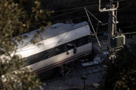 A crashed train remains on the train tracks on January 19, 2026 after yesterdays train collision in Adamuz, Spain.