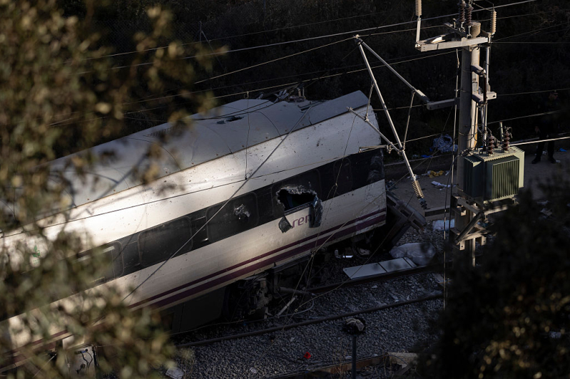 A crashed train remains on the train tracks on January 19, 2026 after yesterdays train collision in Adamuz, Spain.