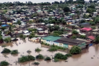 MOZAMBIQUE — An aerial view shows floodwaters inundating residential neighborhoods in Mozambique, where torrential rains have displaced hundreds of thousands of people and caused widespread damage across several provinces.