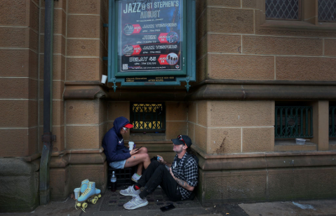 People experiencing homelessness gather outside St Stephen’s Uniting Church in Sydney as a church-linked outreach team provides on-the-spot healthcare and support to hundreds of vulnerable individuals each month across the city.
