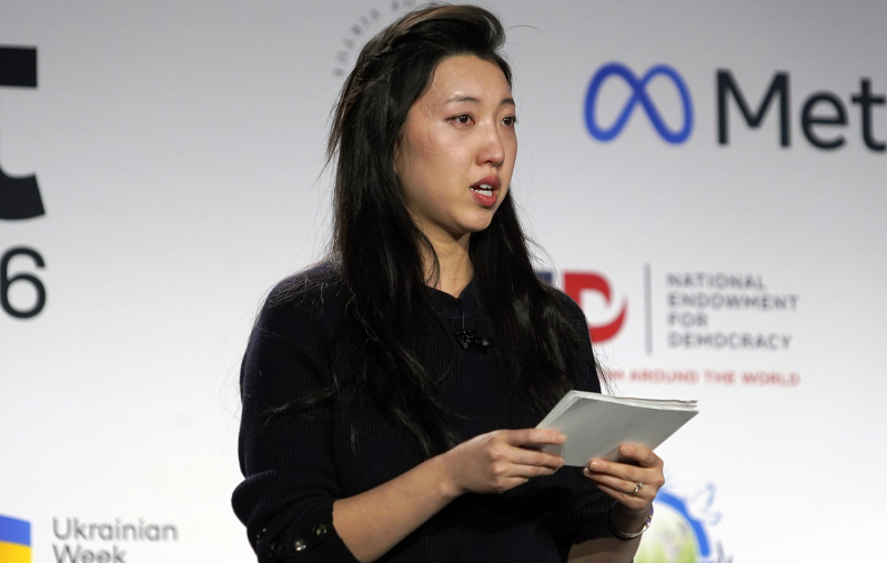 Grace Jin Drexel speaks through tears as she describes how her imprisoned father was unable to attend her wedding or meet his grandchildren during the International Religious Freedom Summit in Washington, Monday, Feb. 2, 2026.