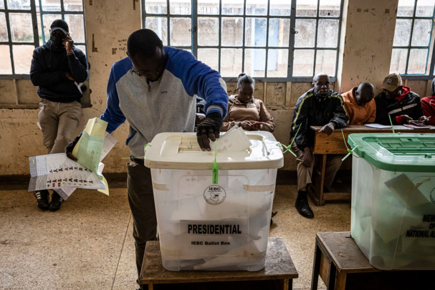 NAIROBI, KENYA — Voters place ballots into boxes at a Nairobi polling station during Kenya’s 2022 general election. The IEBC says lessons from that vote are shaping preparations for 2027.