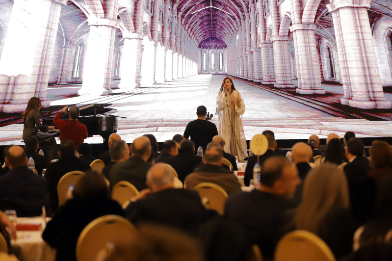 A soprano performs as Lebanese-Jordanian pianist Grace Abu Daher accompanies her on piano during the launch event for the Arabic-dubbed version of The Chosen in Amman, Jordan.