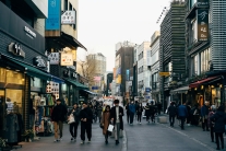 People walk along a busy street in Seoul, Korea, where a growing migrant population now makes up about 5% of the country’s residents, even as a new survey finds only a small share of Korean churches are currently engaged in migrant ministry.