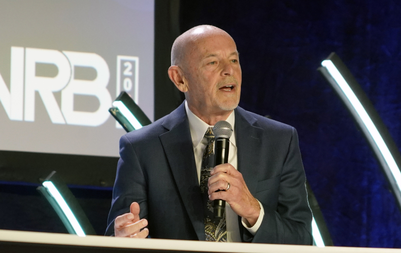 Dr. Byron Johnson of Baylor University speaks during a panel on human flourishing and artificial intelligence, highlighting global research linking close relationships and religious practice to higher well-being outcomes.