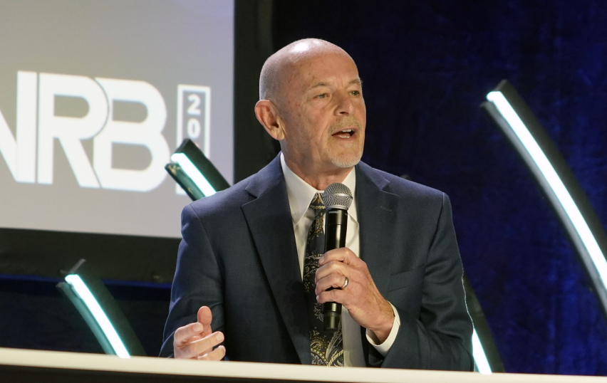 Dr. Byron Johnson of Baylor University speaks during a panel on human flourishing and artificial intelligence, highlighting global research linking close relationships and religious practice to higher well-being outcomes.