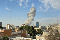 TEHRAN, IRAN - FEBRUARY 28: A plume of smoke rises after an explosion on February 28, 2026 in Tehran, Iran. After explosions were seen in the Iranian capital, the office of the Israeli Defense Minister issued a statement saying it had launched a preemptiv
