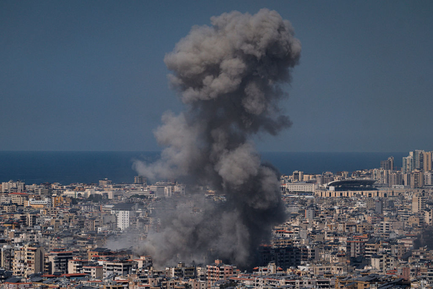 Smoke rises from a building hit in a bombing on March 11, 2026 in Beirut, Lebanon.