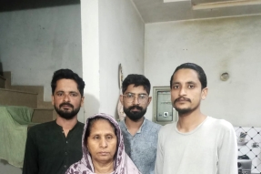 Naseem Bibi and her sons, deprived of their Christian identity in Pakistans national database despite court orders.