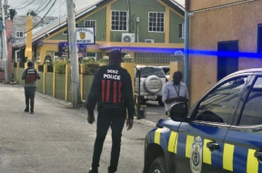 Police officers outside the New Testament Church of God in Montego Bay, St. James, Jamaica, following the fatal shooting of church member Cora Thompson on church grounds during a midweek prayer service.