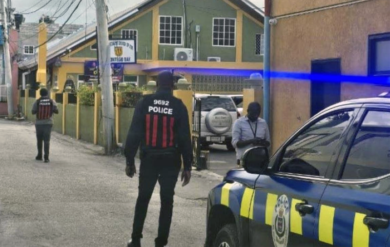 Police officers outside the New Testament Church of God in Montego Bay, St. James, Jamaica, following the fatal shooting of church member Cora Thompson on church grounds during a midweek prayer service.