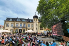 Visitors gather in the courtyard of the Buchenauerhof during the 75th anniversary event hosted by the German missions organization DMG, which drew more than 3,000 attendees for intercultural worship services, exhibitions and mission-related activities.