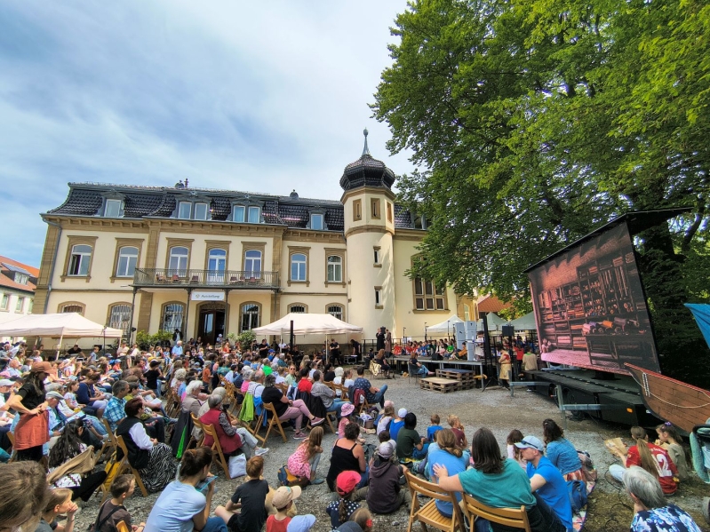 Visitors gather in the courtyard of the Buchenauerhof during the 75th anniversary event hosted by the German missions organization DMG, which drew more than 3,000 attendees for intercultural worship services, exhibitions and mission-related activities.