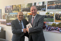 Retired Maj. Gen. Imad Maayah (left), president of Jordans Evangelical Council, shakes hands with Sen. Michael Nazzal following their meeting in Amman.