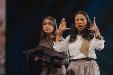 Vina, an Indonesian survivor of a 2021 church bombing, addresses roughly 9,000 attendees at the Open Doors Days gathering in Karlsruhe, Germany.