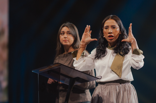 Vina, an Indonesian survivor of a 2021 church bombing, addresses roughly 9,000 attendees at the Open Doors Days gathering in Karlsruhe, Germany.