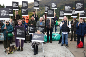 Demonstrators gather outside the Scottish Parliament in Edinburgh on Sept. 24, 2024, to protest a law banning demonstrations within 200 meters of abortion clinics. New Public Health Scotland data shows the country recorded its highest-ever number of abort