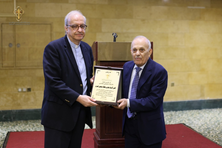 The president of the Jordan Evangelical Council presents a commemorative plaque to World Evangelical Alliance Secretary General Rev. Botrus Mansour at a ceremony hosted by the council on May 30, the day after Jordans centennial celebration of organized e