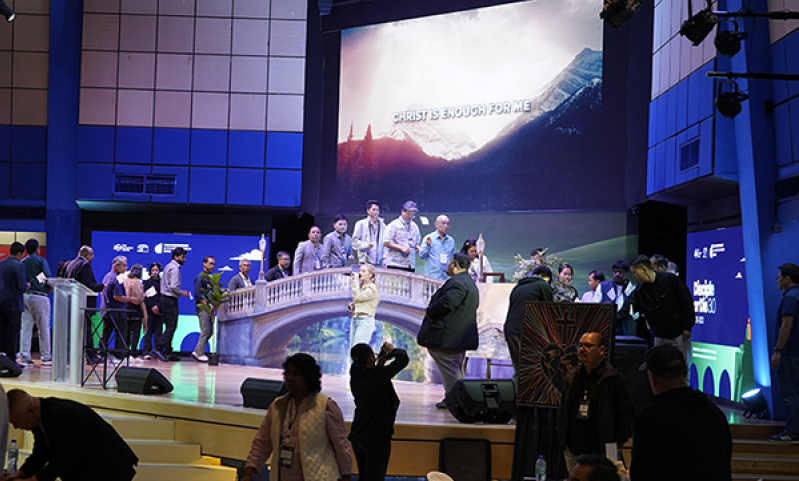 Delegates cross a symbolic bridge carrying white flags during the closing ceremony of the Asia Conference on Church & Mission 2026 in Alabang, Metro Manila, June 11, 2026. Each flag bore the name of a church or community the delegate committed before God