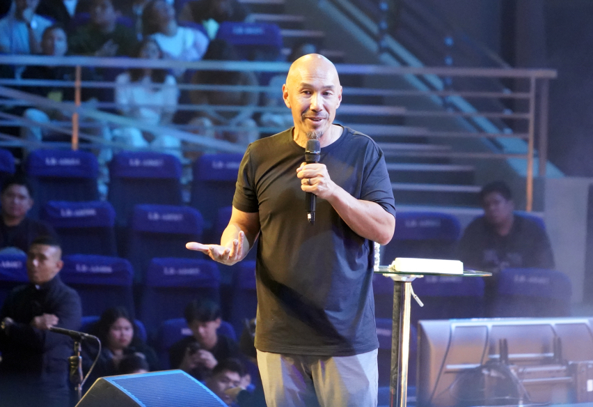 Francis Chan addresses participants at The Send Philippines, June 12, 2026, urging young Christians to share their faith in everyday settings — at school, at work, and in their communities.