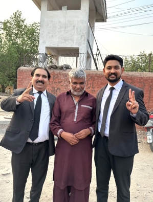 Nadeem Masih with attorneys Javed Sahotra (L) and Shawaiz Javed (R) after his release from prison on June 23, 2026.