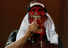 A fan of Flamengo prays before a match