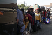 Migrants line up to leave South Africa on Monday, June 30, 2026, as an unofficial deadline set by anti-immigration groups demanding their departure took effect. Nearly 25,000 foreign nationals left the country amid the crisis, while many others sought ref