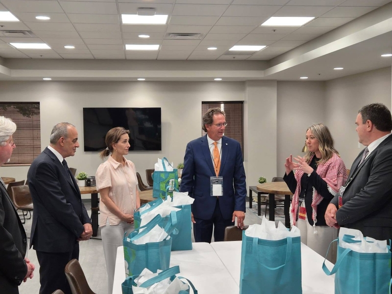The Rev. Dennis Wiles, center, meets with members of the planning team during the churchs partnership with Jordans World Cup delegation.