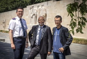 (From Left) Markus Hofer, Joseph Kabongo and Michael Mutzner in front of the Reformation Wall in Geneva.