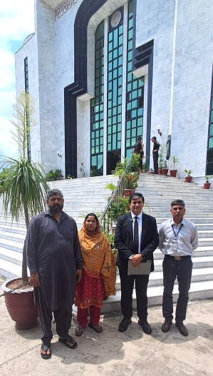 Maria Shahbaz’s parents Shahbaz Masih and Erum Shahbaz with attorney Saqib Jillani and rights activist Safdar Chaudhry (R) at Federal Constitutional Court building.