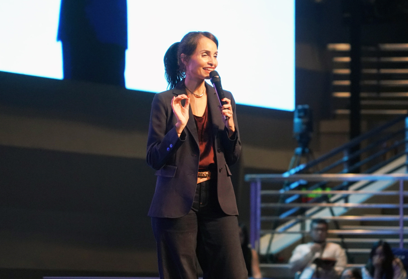 Sarah Breuel, a Brazilian missionary serving in Rome, Italy, addresses delegates during the evening session of the Arise Asia 2026 Congress at Christs Commission Fellowship Central in Manila, Philippines, July 30, 2026.