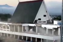 A multi-story building collapses on Indonesias Flores Island, after a magnitude-7.7 earthquake struck off the coast of East Nusa Tenggara Province on Saturday, Aug. 15, 2026.