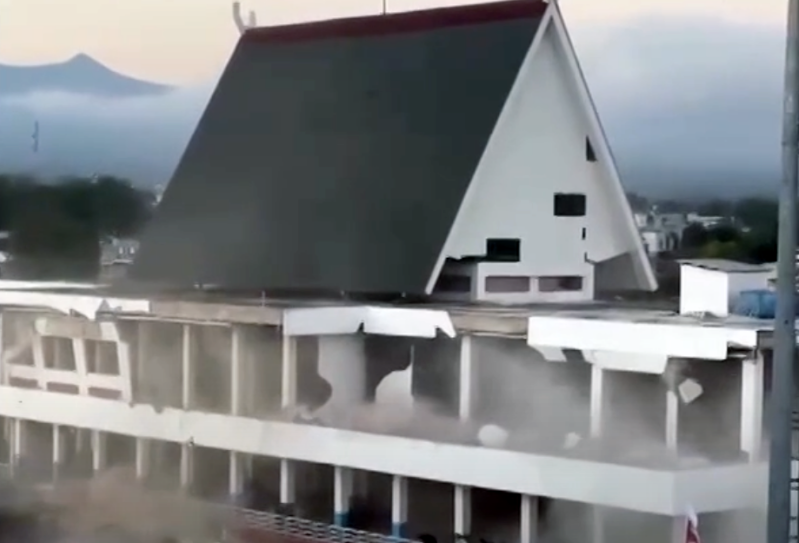 A multi-story building collapses on Indonesias Flores Island, after a magnitude-7.7 earthquake struck off the coast of East Nusa Tenggara Province on Saturday, Aug. 15, 2026.