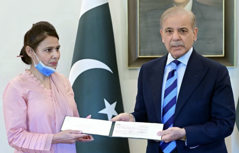 Prime Minister Shehbaz Sharif hands a check of 10 million Pakistani rupees ($36,000) to Christian Staff Nurse Razia Noreen during a meeting at PMs House on Thursday, Sept. 3, 2026.