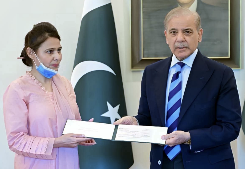 Prime Minister Shehbaz Sharif hands a check of 10 million Pakistani rupees ($36,000) to Christian Staff Nurse Razia Noreen during a meeting at PMs House on Thursday, Sept. 3, 2026.