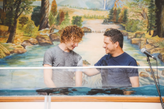 Albert Oliveira baptizes a new believer at First Baptist Church of Gordon, Texas, in July.