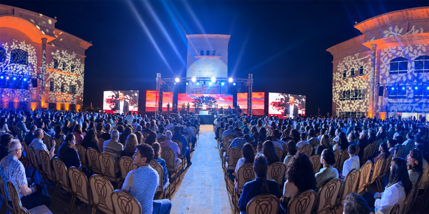 Attendees fill the courtyard of the Jordan Evangelical Theological Seminary during the Christ Our Hope evangelistic service in Amman, Jordan, on Friday, Sept. 4, 2026.