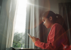 A young woman using a smartphone. AI. technology. Mobile phone.