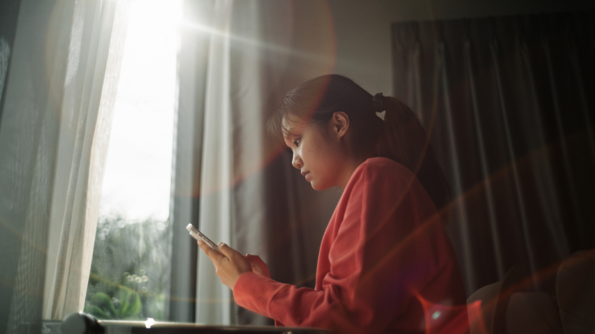 A young woman using a smartphone. AI. technology. Mobile phone.