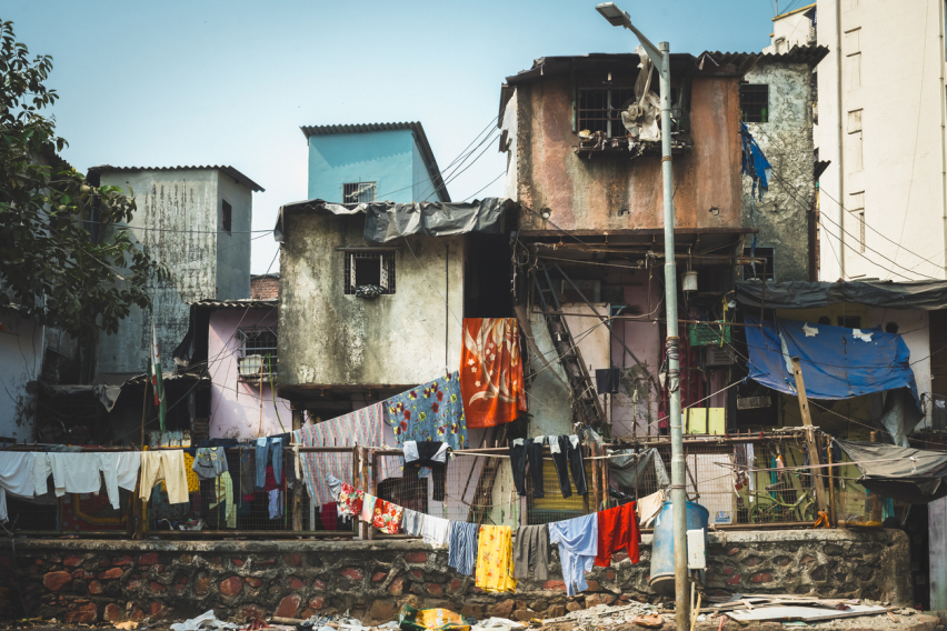 Facades of huts in a slum in South Asia. Poverty.