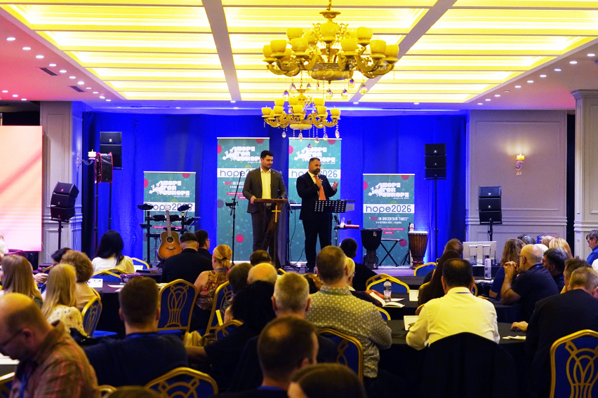 Alesio Sema (left), general secretary of the Albanian Evangelical Alliance (VUSH), and Erion Prendi of VUSH welcome participants to Albania at the opening of Hope for Europe 2026 in Golem, Albania, on Monday, Oct. 5, 2026.