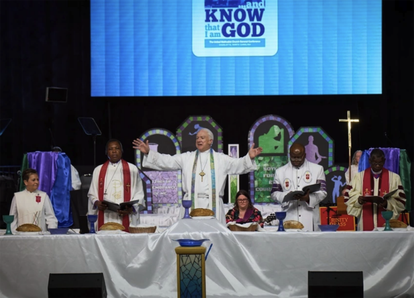 During the opening worship service of the United Methodist General Conference in Charlotte, North Carolina, on April 23, 2024, five United Methodist bishops from around the world celebrate communion with participants.