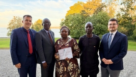 Rhoda Jatau, center, a Nigerian Christian mother acquitted in 2024 of blasphemy-related charges after 19 months in prison, holds the 2026 Shahbaz Bhatti Freedom Award in Geneva, Switzerland.