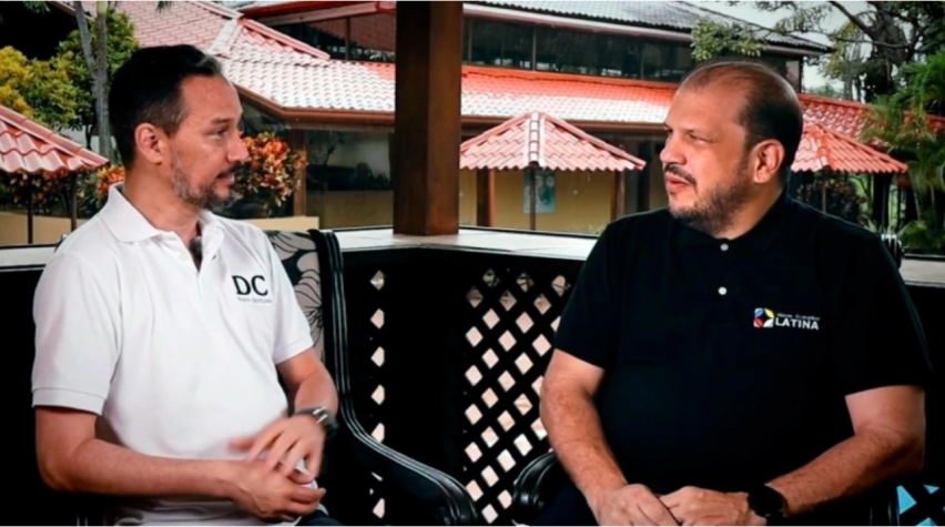 Javier Bolaños (left), director of Christian Daily International, speaks with Juan Cruz Cellammare (right