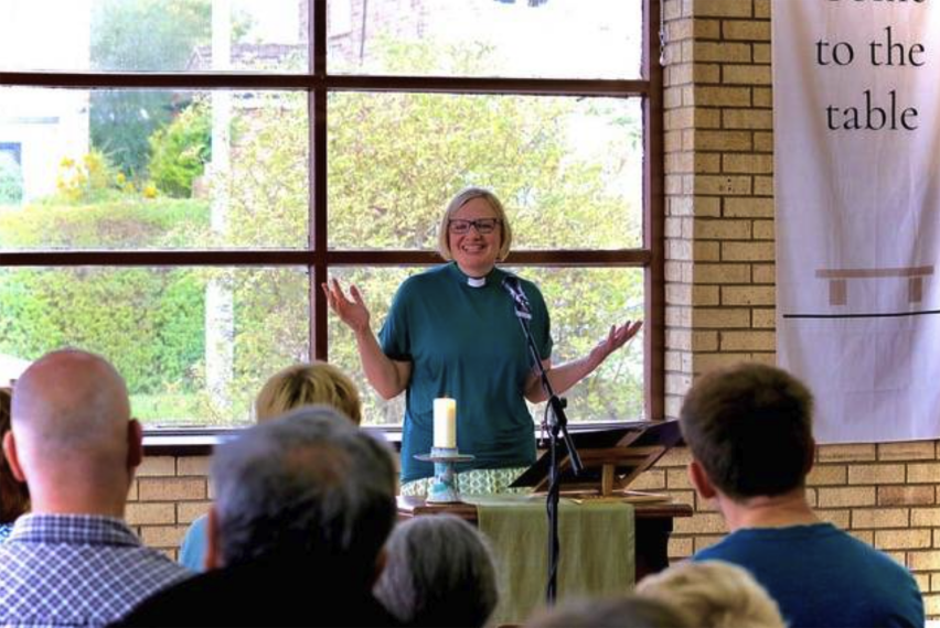 The Rev. Hannah Jones speaks during the first Sunday service at St. Luke’s Community Church in the Swarcliffe estate of Leeds, England, Sept. 6. The congregation is meeting in the church hall while the main sanctuary is renovated.