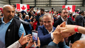 Mark Carney emphasizes humility after Liberals win Canada's national election, takes strong stand against Trump